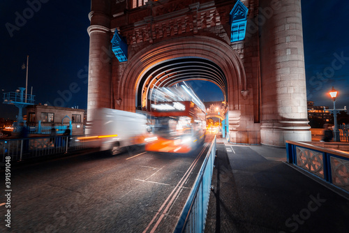 night view of Tower Bridge traffic, London, UK