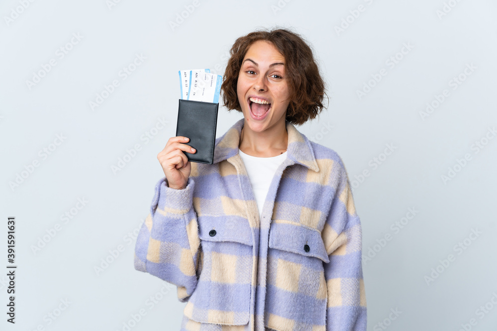 Young English woman isolated on white background happy in vacation with passport and plane tickets Young English woman isolated on white background happy in vacation with passport and plane tickets