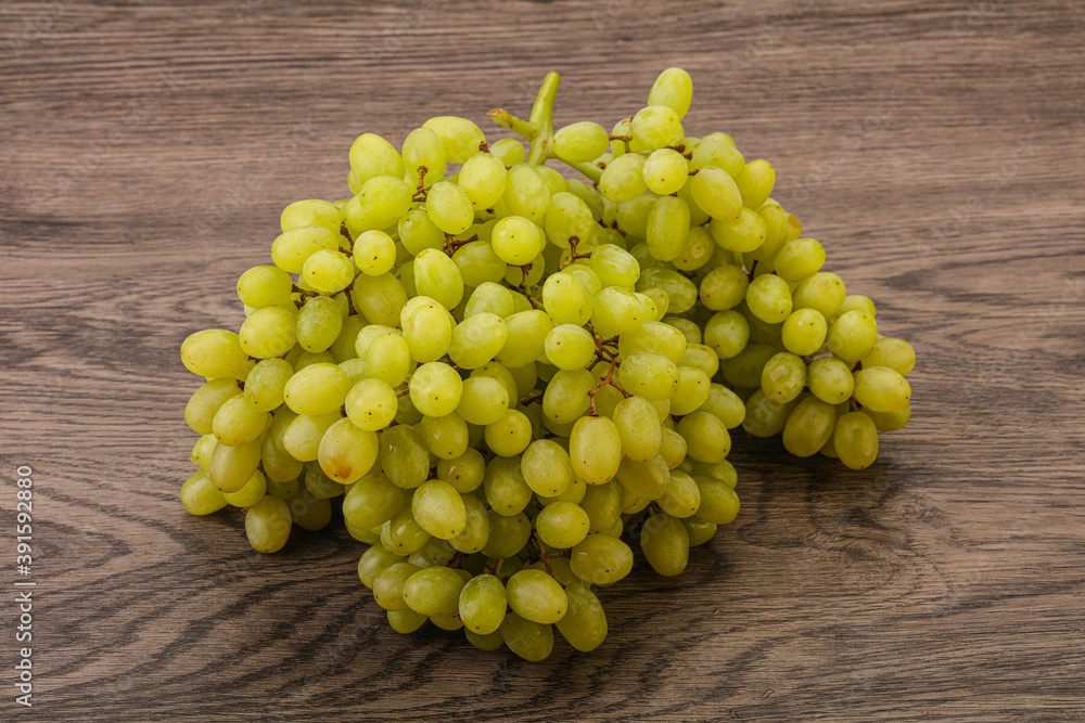 Green grape branch over background Green grape branch over background
