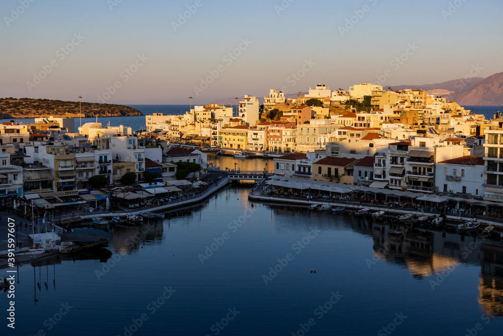 Beautiful late even sunlight illuminating buildings in the centre of the Cretan town of Agios Nikolaos