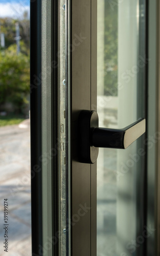 Aluminum door window closeup view, blurry background