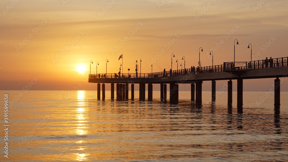 pier in a yellow sunset
