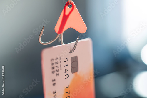 Close-up of a credit card on a fishing hook photo