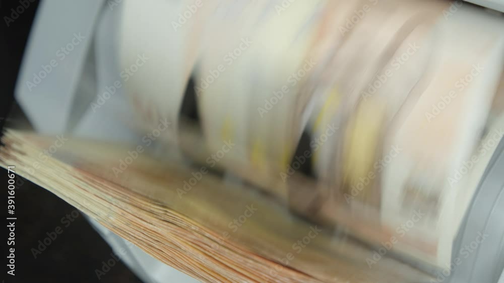 Euro bills going through the counting mechanism Euro bills going through the counting mechanism