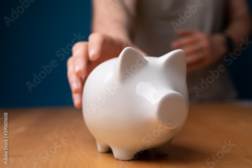 white piggy bank insurance money