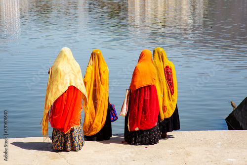 Four Indian women ready to sacred bath in Pushkar lake, Rajasthan, India