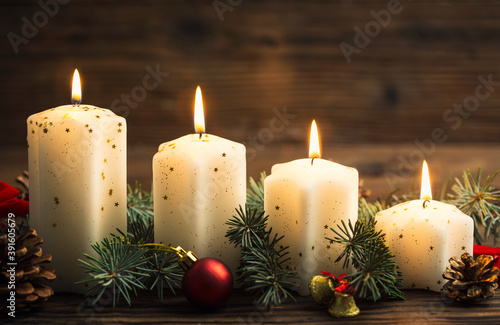 Christmas decoration with candles on the wooden table