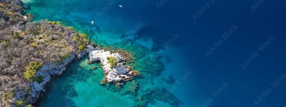 Aerial drone ultra wide panoramic photo of tropical paradise deep turquoise lagoon with beautiful seascape in exotic destination island