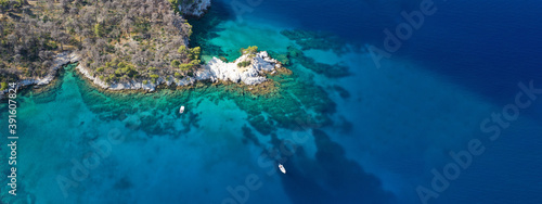 Aerial drone ultra wide panoramic photo of famous from Mamma Mia movie Three pine cape Amarantos a truly scenic place with crystal clear sea, Skopelos island, Sporades, Greece