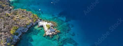 Aerial drone ultra wide panoramic photo of tropical paradise deep turquoise lagoon with beautiful seascape in exotic destination island © aerial-drone
