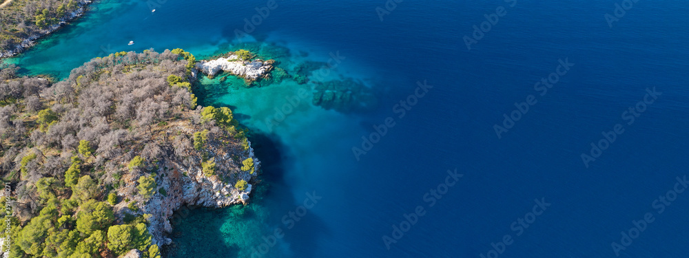 Aerial drone ultra wide panoramic photo of famous from Mamma Mia movie Three pine cape Amarantos a truly scenic place with crystal clear sea, Skopelos island, Sporades, Greece Aerial drone ultra wide panoramic photo of famous from Mamma Mia movie Three pine cape Amarantos a truly scenic place with crystal clear sea, Skopelos island, Sporades, Greece
