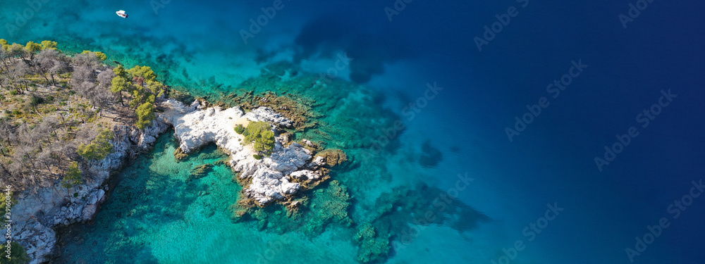 Aerial drone ultra wide panoramic photo of famous from Mamma Mia movie Three pine cape Amarantos a truly scenic place with crystal clear sea, Skopelos island, Sporades, Greece