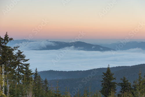 Winter in the Ukrainian Carpathian mountains with morning fogs