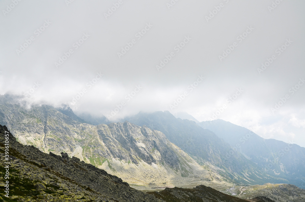 Mountain peaks, low clouds and fog. High Tatras Mountains in Slovakia