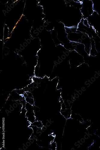 marble background with white veins on a black background