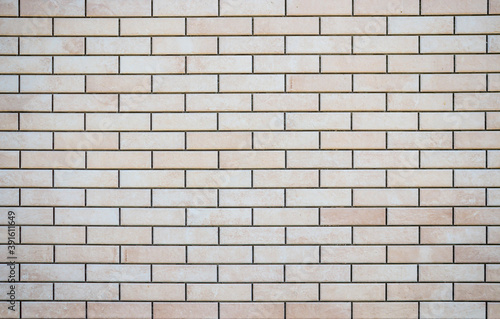 Photo of a wall of tiles as a background. Artificial building stone.