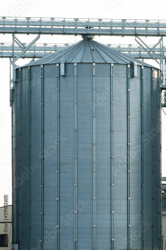 Wallpaper Mural silver silos on agro manufacturing plant for processing drying cleaning and storage of agricultural products, flour, cereals and grain. Large iron barrels of grain. Granary elevator Torontodigital.ca