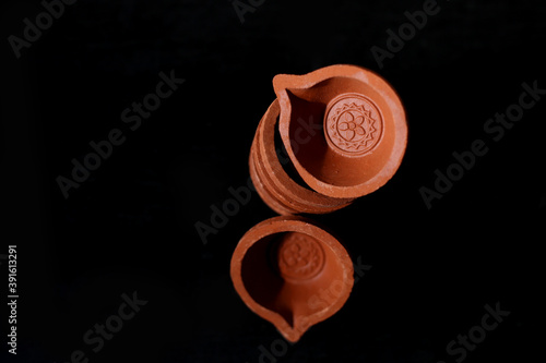Traditional Diwali diya or clay lamp, Terracotta diyas or oil lamps. oil lamps of baked clay, popularly used during Diwali festival in India