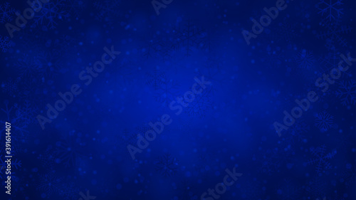 Christmas background of snowflakes of different shapes, sizes and transparency in blue colors