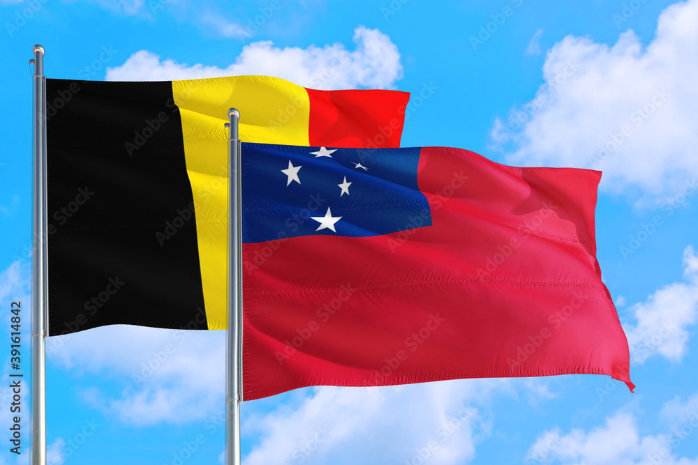 Samoa and Belgium national flag waving in the windy deep blue sky. Diplomacy and international relations concept. Samoa and Belgium national flag waving in the windy deep blue sky. Diplomacy and international relations concept.