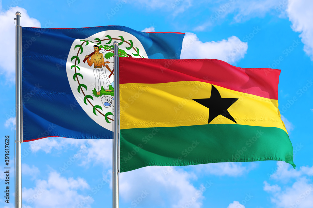 Ghana and Belize national flag waving in the windy deep blue sky. Diplomacy and international relations concept. Ghana and Belize national flag waving in the windy deep blue sky. Diplomacy and international relations concept.