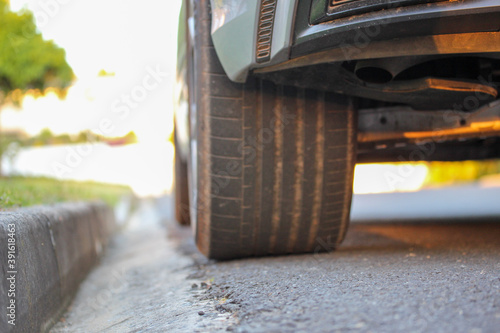 Картината върху платно Car parked near the sidewalk