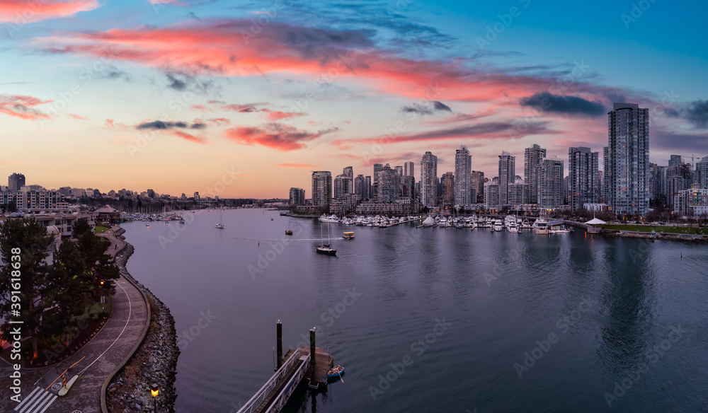 False Creek, Vancouver, British Columbia, Canada. Aerial Panoramic View of a Modern Downtown City View. Dramatic Colorful Sunset Sky.