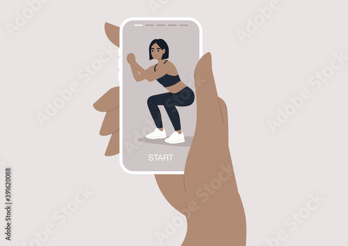 A young female digital instructor doing squats, an online workout scene, sport outfit