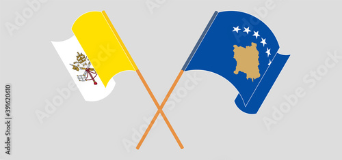 Crossed and waving flags of Vatican and Kosovo