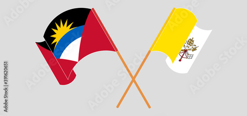 Crossed and waving flags of Vatican and Antigua and Barbuda