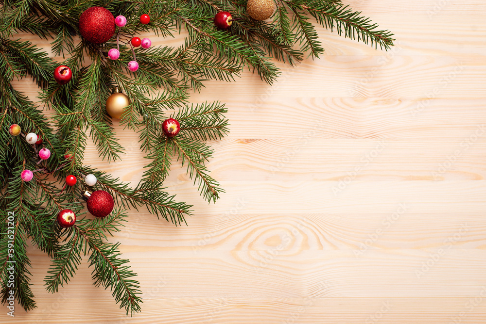 Decorated branches of christmas tree on wooden table. Copy space, new year holidays theme. Decorated branches of christmas tree on wooden table. Copy space, new year holidays theme.