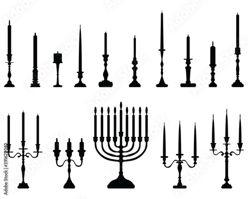 Black silhouettes of candlesticks on a white background