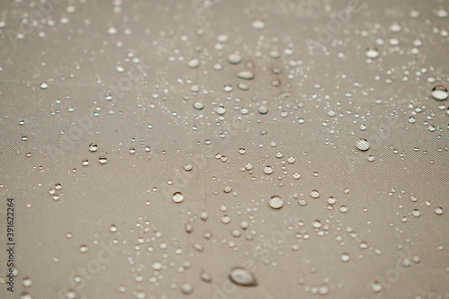 Photography Beige / brown / gray umbrella fabric with small rain drops on it