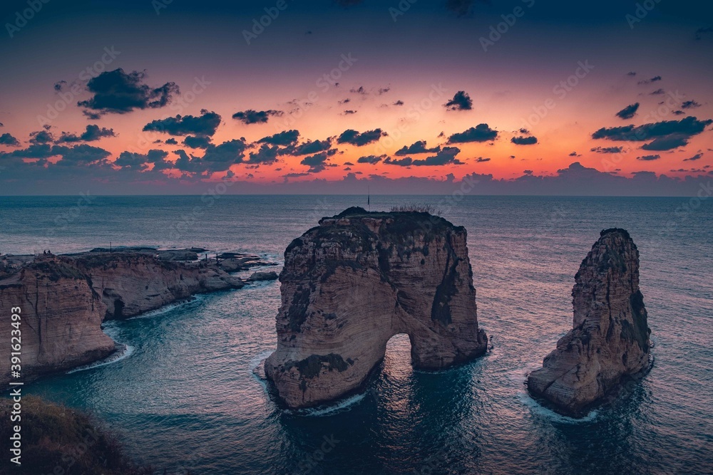 Naklejka premium Lebanon, Beirut- Sunset over the Raouche Rocks