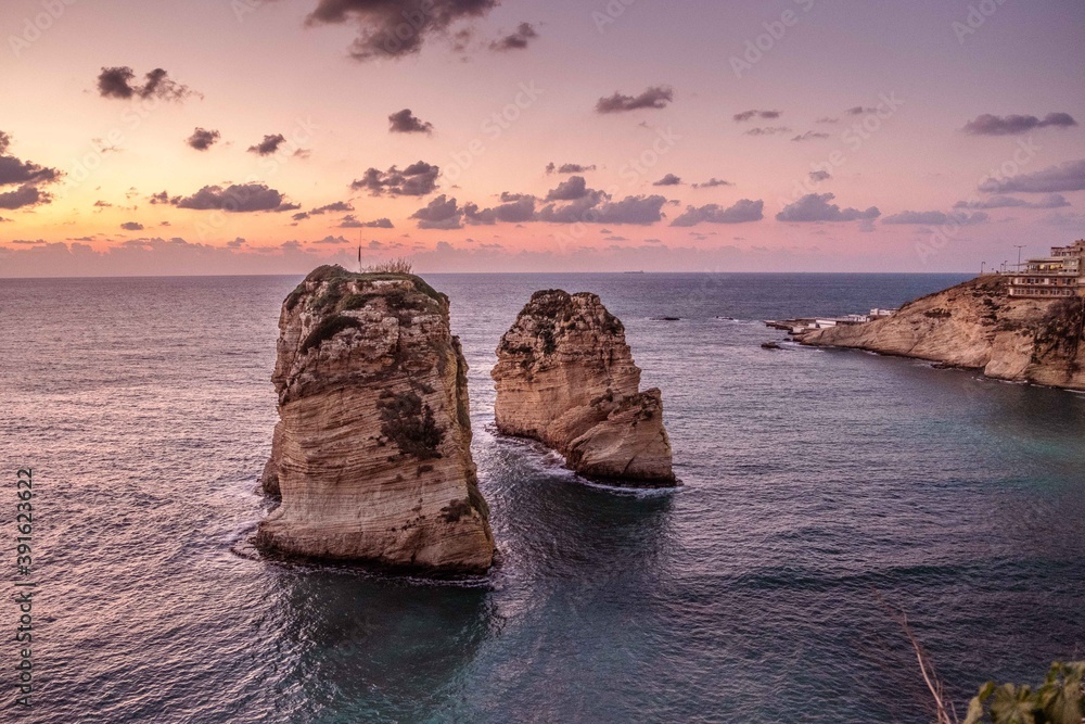 Fototapeta premium Lebanon, Beirut- Sunset over the Raouche Rocks