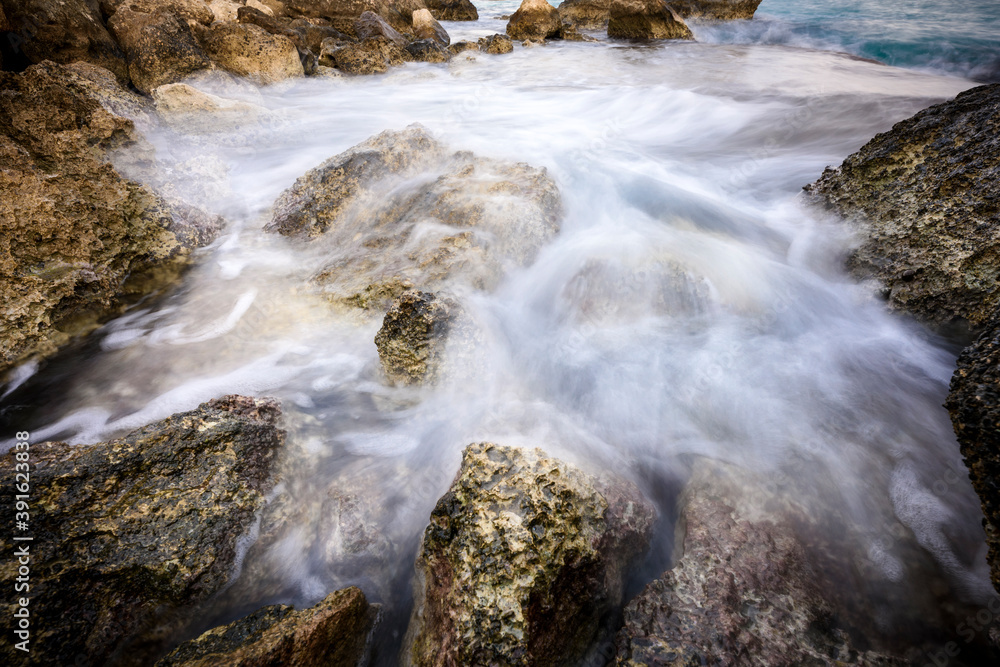 Splasing water on the stones in long exposure Splasing water on the stones in long exposure