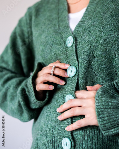 young woman in Green, cosy casual cardigan