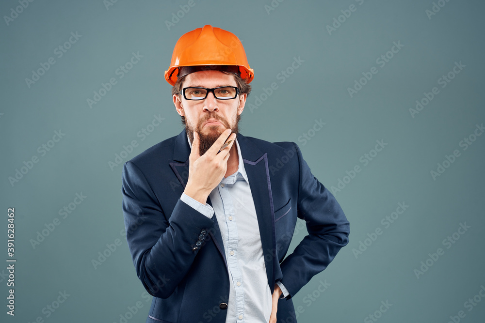 Man in safety suit orange helmet construction industry professional Man in safety suit orange helmet construction industry professional