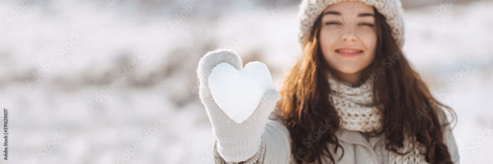 Snow Heart in Hand of a Woman Snow Heart in Hand of a Woman