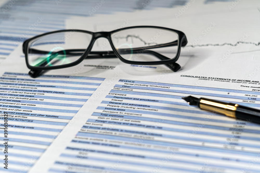 Concepts business finance plan. Accounting and financial analysis budget statement with eyeglasses and pen. Concepts business finance plan. Accounting and financial analysis budget statement with eyeglasses and pen.