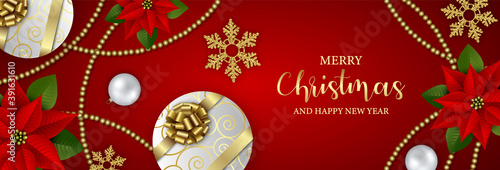 merry christmas banner with gift boxes, snowflakes, poinsettia flowers and christmas decorations