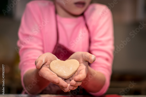 christmas gingerbread biscuits in heart shape background photo