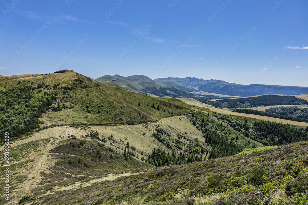 Fototapeta premium Beautiful highland landscapes in Volcans d'Auvergne regional Natural Park. Massif Central, Auvergne-Rhone-Alpes administrative region, France.