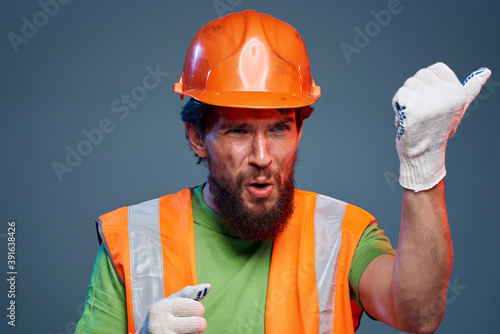 Emotional man on orange paint professional builders work