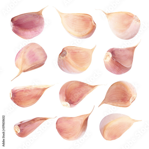 Set of fresh garlic cloves on white background
