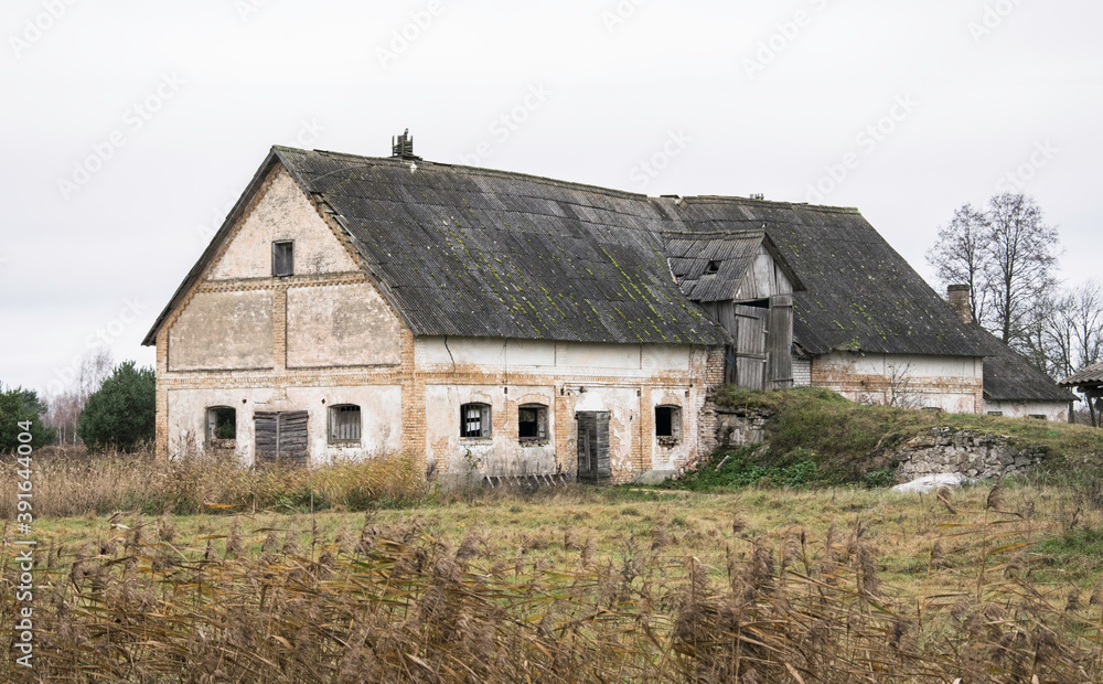 An od abandoned brick shed for livestock and hay storage