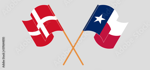 Crossed and waving flags of the State of Texas and Denmark