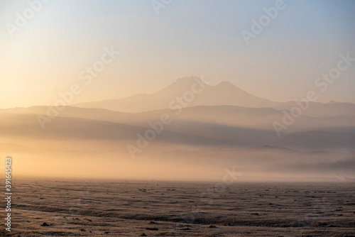 Sunrise with the mist over the river and the plain in Kayseri  in front of Erciyes mountain