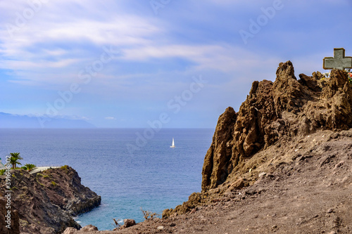 The west coast of Tenerife on whose rugged cliffs the place Puerto de Santiago nestles. The impressive landscape of rugged rocks and the endless expanse of the sea. 