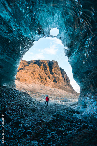 Obraz na plátně Solo female adventure traveler is discovering the ice caves in Iceland at Vatnajokull Glacier near to Jokulsarlon Glacier Lagoon